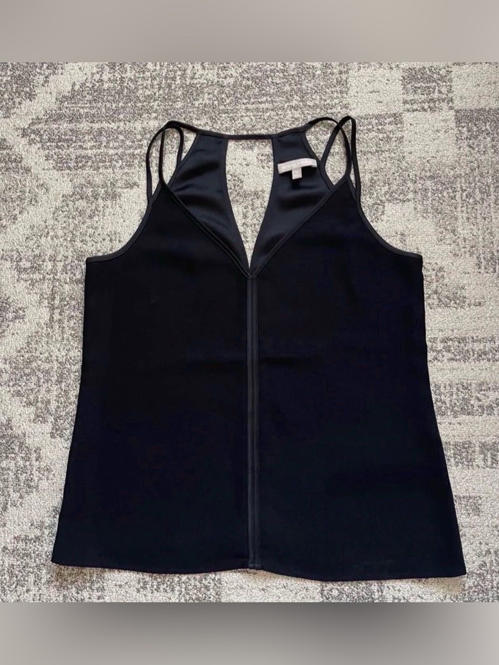 Banana Republic black camisole top with a V-neck and spaghetti straps, size 10
